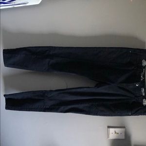 Reitmans navy jeans with designs on thighs